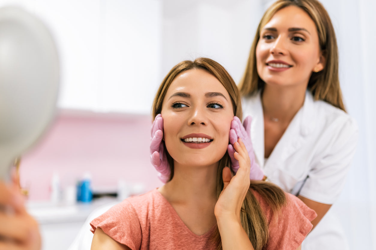dermatologist and patient reviewing skin care results